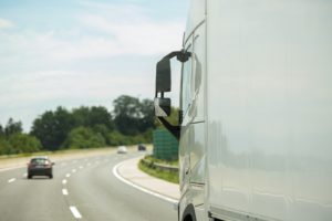 Modern Semi Truck on a Highway Right Before Strong Curve